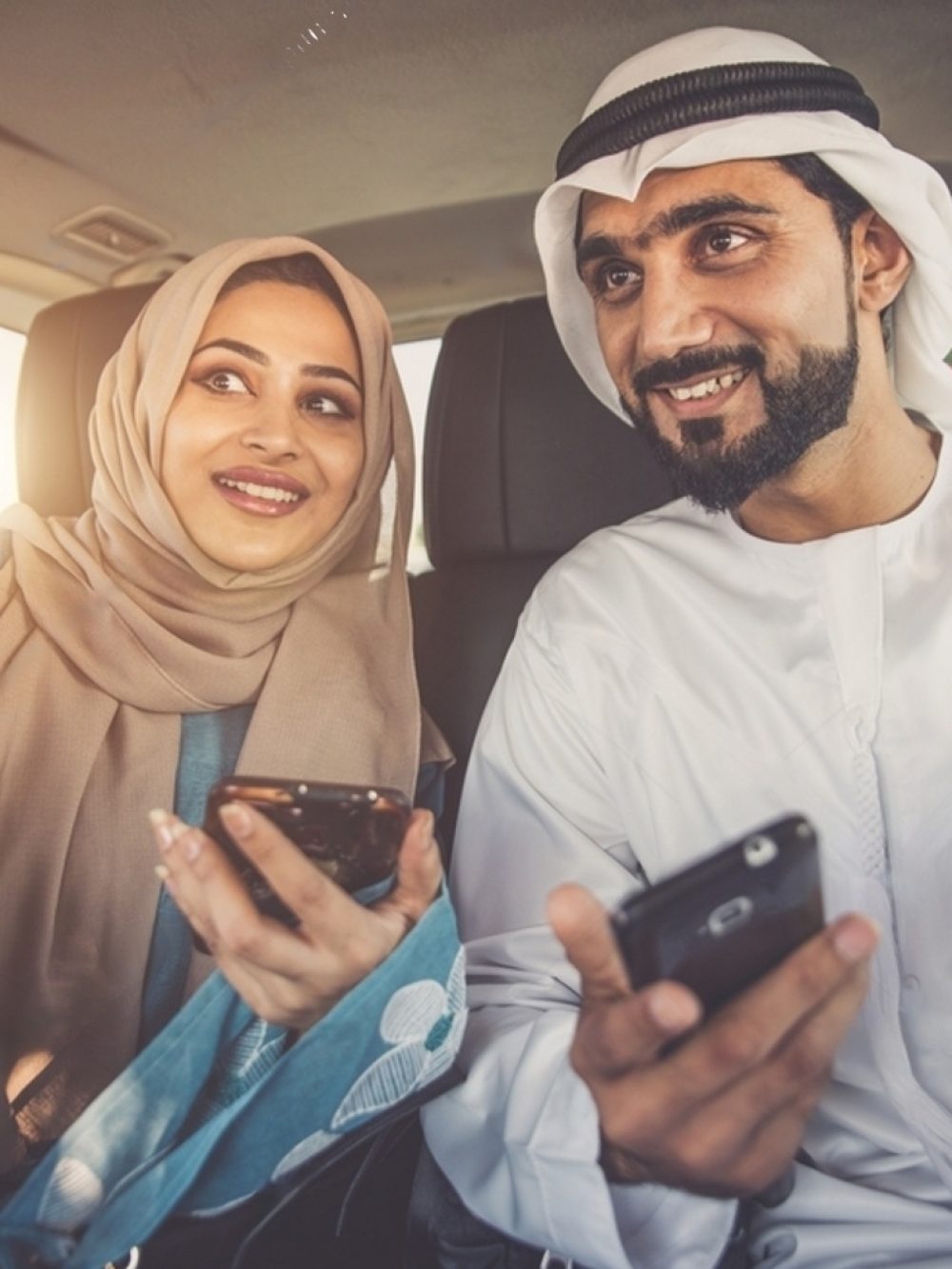 stock-photo-happy-couple-driving-the-car-in-dubai-man-and-woman-going-out-for-shopping-concept-about-2264281941-transformed (1)